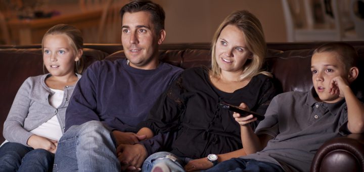 Family watching Television together