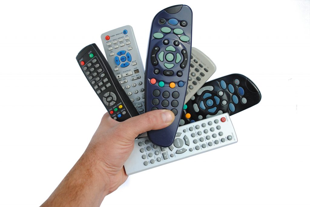 man hand holds six remote control