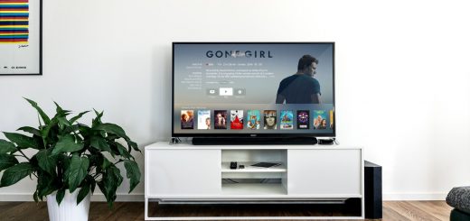 Flat Screen TV on White Wooden TV Rack in Living Room