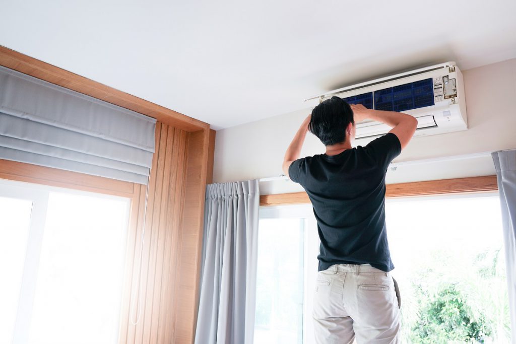 Technician repairing and maintenance Air conditioner