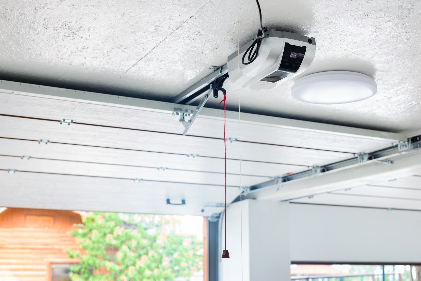 automatic garage door opener electric engine gear mounted on ceiling with emergency cord